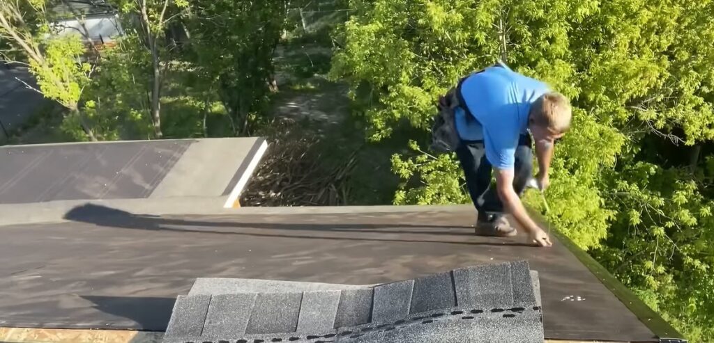 Albuquerque Roofing Guys crew member installing shingles during a roof replacement